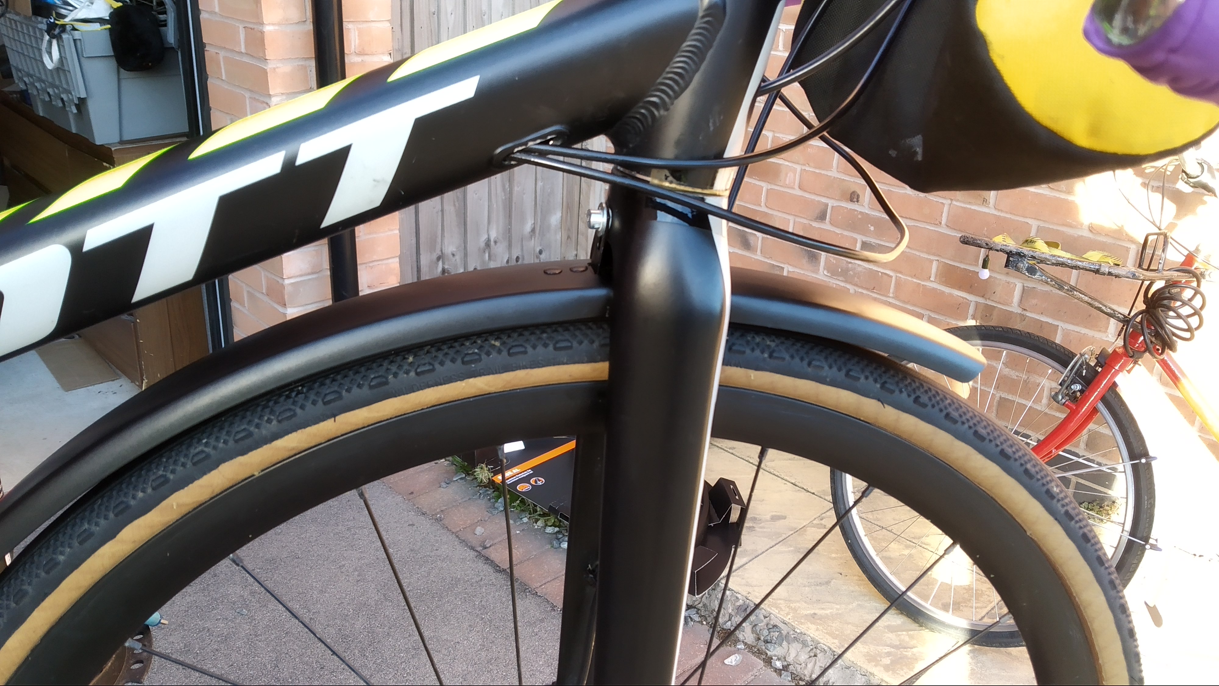 The front of the bike with mudguard attached. It's got at least 1.5mm clearance