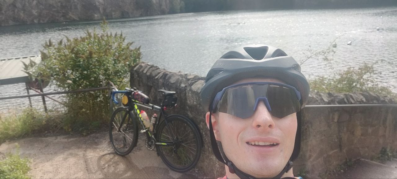 A selfie of me with my bike behind me. From the last selfie of me I've taken my jacket and gillet off, and am wearing sunglasses