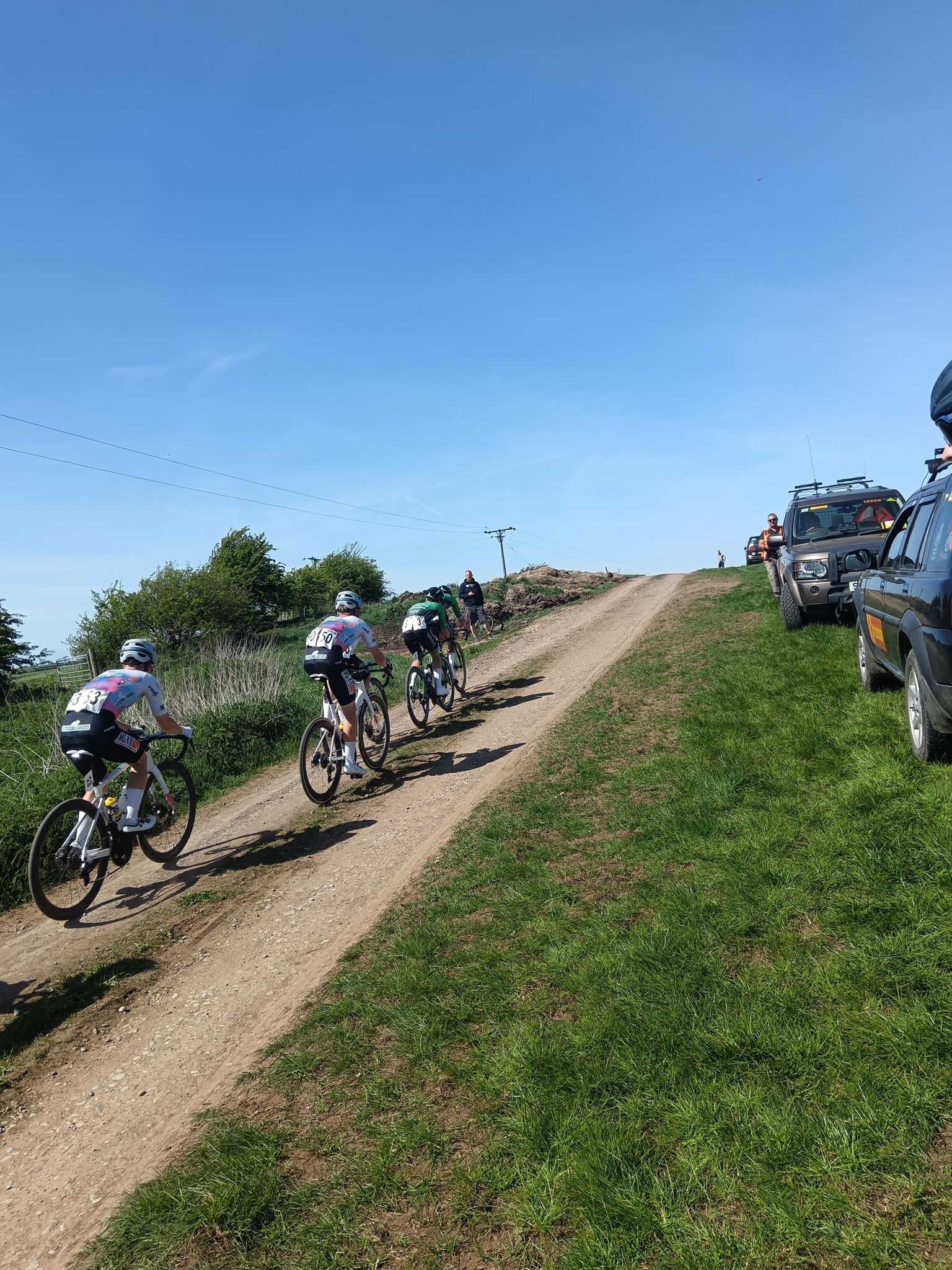 A group of 4 riders racing up the hill of the Sommerberg
